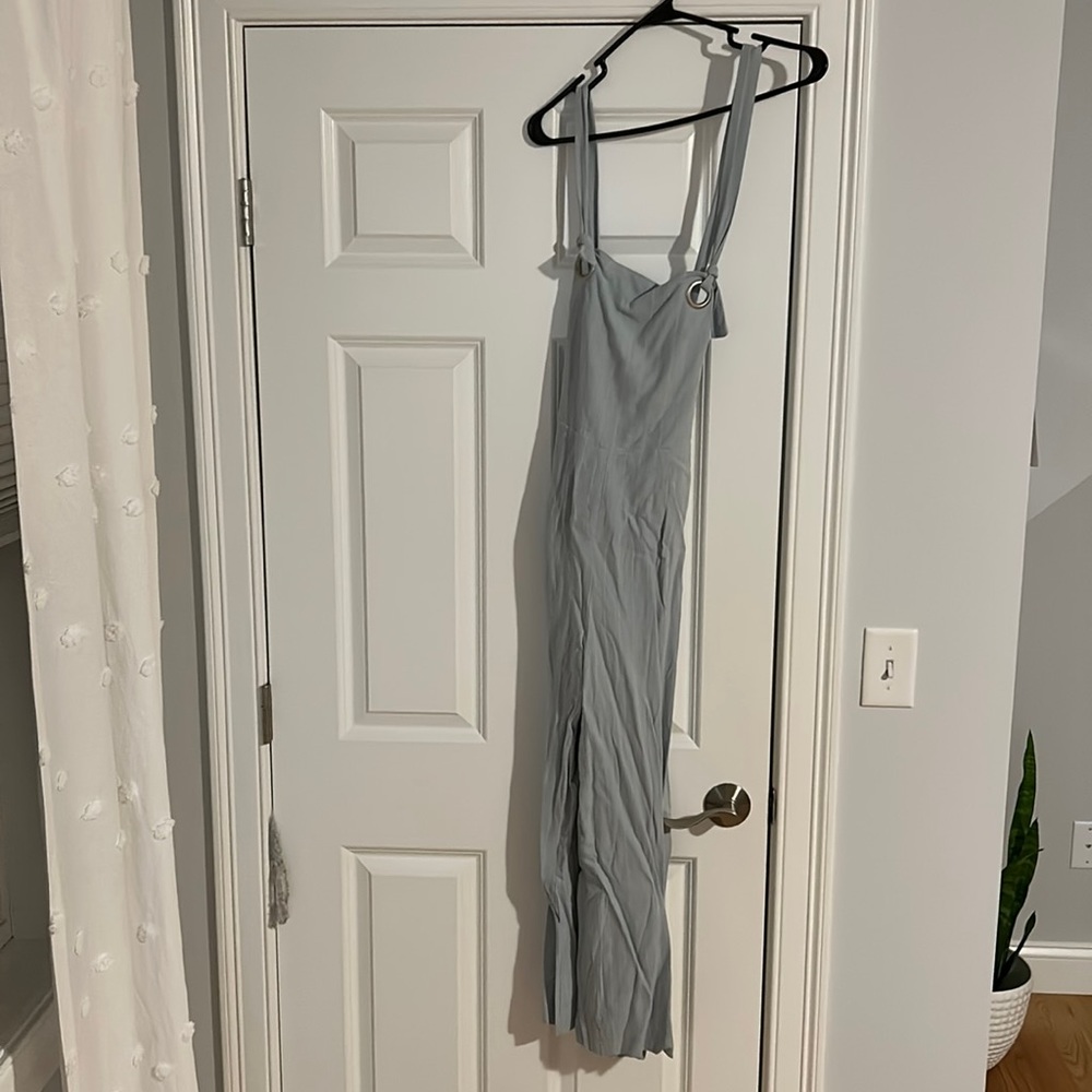 New with tags strappy jumpsuit! Light blue with pin white stripes.